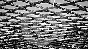 Rustic metal fence texture, black and white photo