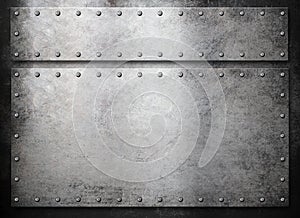 Rustic metal plates over dark background