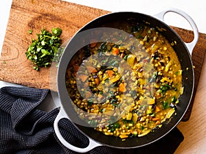 Rustic mung bean dahl curry in natural light photo