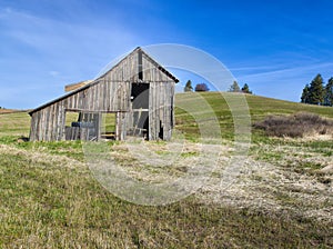 Rustic old barn in field. photo