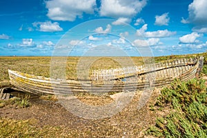 Rustic old boat left to decay on Salt Marshes between Blakeney and Cley