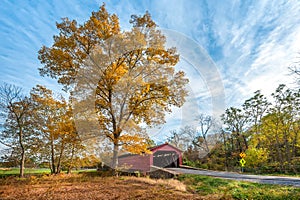Rustic old covered bridge in the bucolic setting of the Maryland countryside during Autumn photo