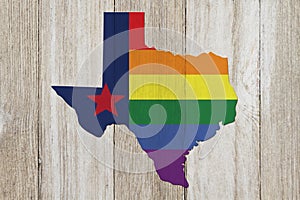 A rustic old Texas pride flag with state map on weathered wood