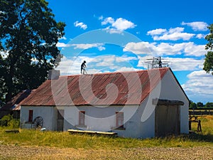 Rustic Old Whitewashed Irish Cottage with fiddler on roof