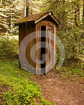 Rustic outhouse photo