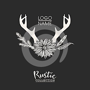 Rustic premade typographic logo with flowers, branches, antlers and feathers.