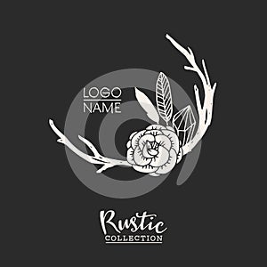 Rustic premade typographic logo with flowers, branches, antlers and feathers. photo