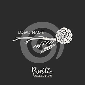 Rustic premade typographic logo with flowers, branches and feathers.