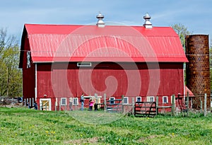 Rustic red barn on a family farm
