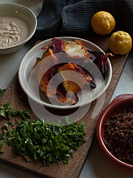 Rustic roast pumpkin slices on wooden board