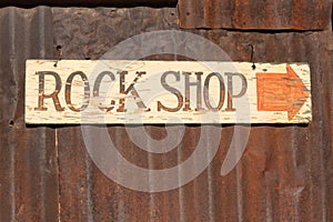 Rustic rock shop sign