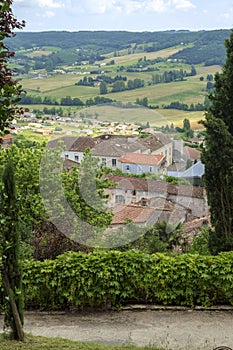 Rustic rooftops and rural countryside in hilltop medieval Penne d`Agenaise town, Lot-et-Garonne, France