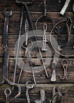 Rustic rural tools used by ancestors in the village in agriculture, carpentry, by blacksmiths. Ancient work tools on vintage