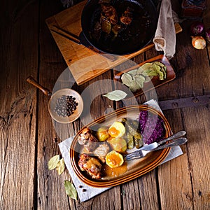 Rustic Snirtjebraten with red cabbage and cucumber photo