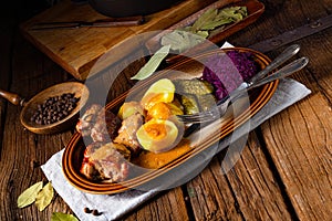 Rustic Snirtjebraten with red cabbage and cucumber photo