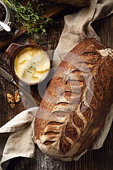 Rustic sourdough bread on wooden table