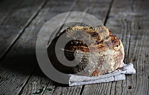 Rustic sourdough loaf, artesan bread on wood