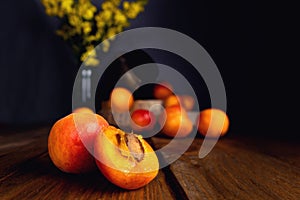 Rustic still life of apricots on wooden table. organic fruit concept. Selective focus