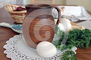 Rustic still life with clay jug and eggs