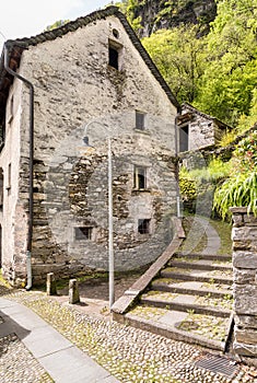 Ancient village Moghegno with rustic stone houses, hamlet of Maggia Ticino, Switzerland photo