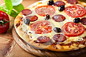 Rustic stonebaked pizza with chorizo salami
