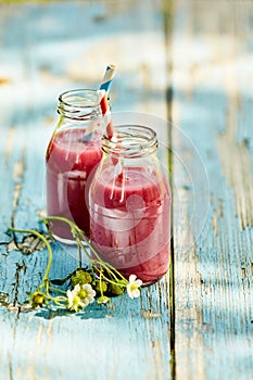 Rustic strawberry smoothies summer picnic table