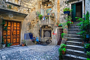 Rustic street view with stone houses in Trogir, Dalmatia, Croatia