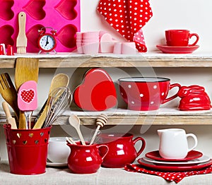 A rustic style. Ceramic tableware and kitchenware in red on the