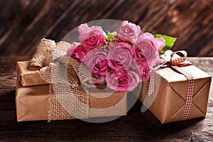 Rustic style gift boxes and pink roses