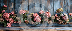 In this rustic style photo, hortensia flowers with orchidea are surrounded by photo frames on a rustic wooden plank photo