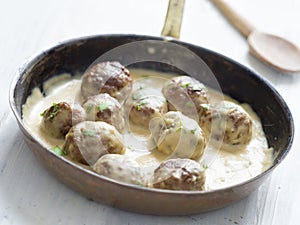 Rustic swedish meatballs in a pan photo