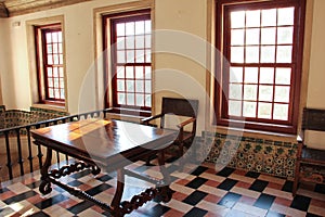 Rustic table and chair in a sunlit room