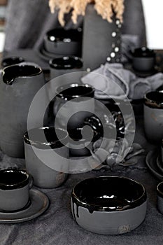 Rustic table setting with empty craft handmade ceramic tableware