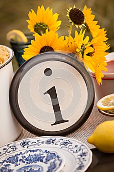 Rustic table setting with lettered plate.