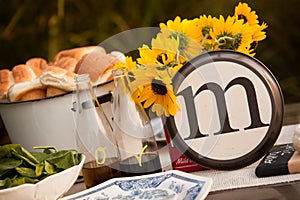 Rustic table setting with lettered plate.