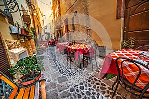 Rustic tables and chairs by a trattoria
