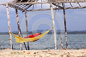 Rustic tent with hammock inside the beach. Deserted beach of Mangue Seco; Jandaira; Bahia; Brazil