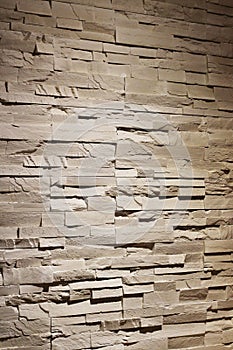 Rustic texture wall brick sandstone with shadows and deep texture interior background photo