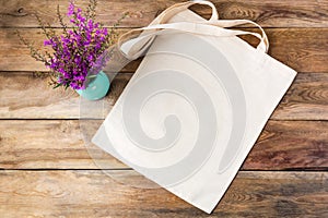 Rustic tote bag mockup with purple flowers