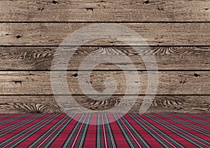 Rustic tradional wooden Christmas background with red and green plaid pattern ground photo