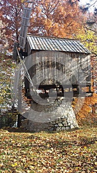 Rustic traditional wind mill with timber walls