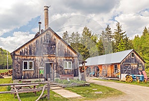 rustic Vermont maple sugar house and barn in Spring