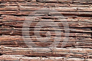 Rustic very old log wall background