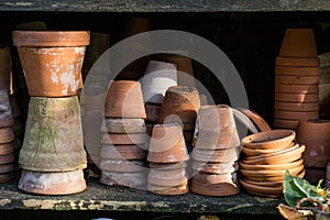 Rustic vintage stacks of terracotta flower pots