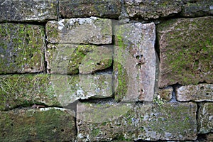 Rustic wall of natural stones as a background