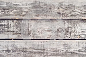 Rustic weathered barn wood background with knots and nail holes