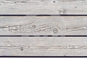 Rustic weathered barn wood background with knots and nail holes