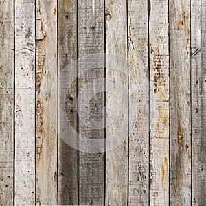 Rustic weathered barn wood background with knots and nail holes