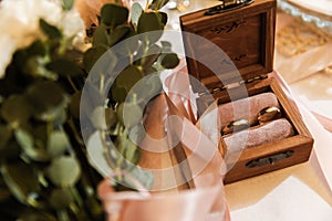 Rustic wedding bouquet and rings