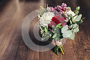 Rustic wedding bouquet on wooden background